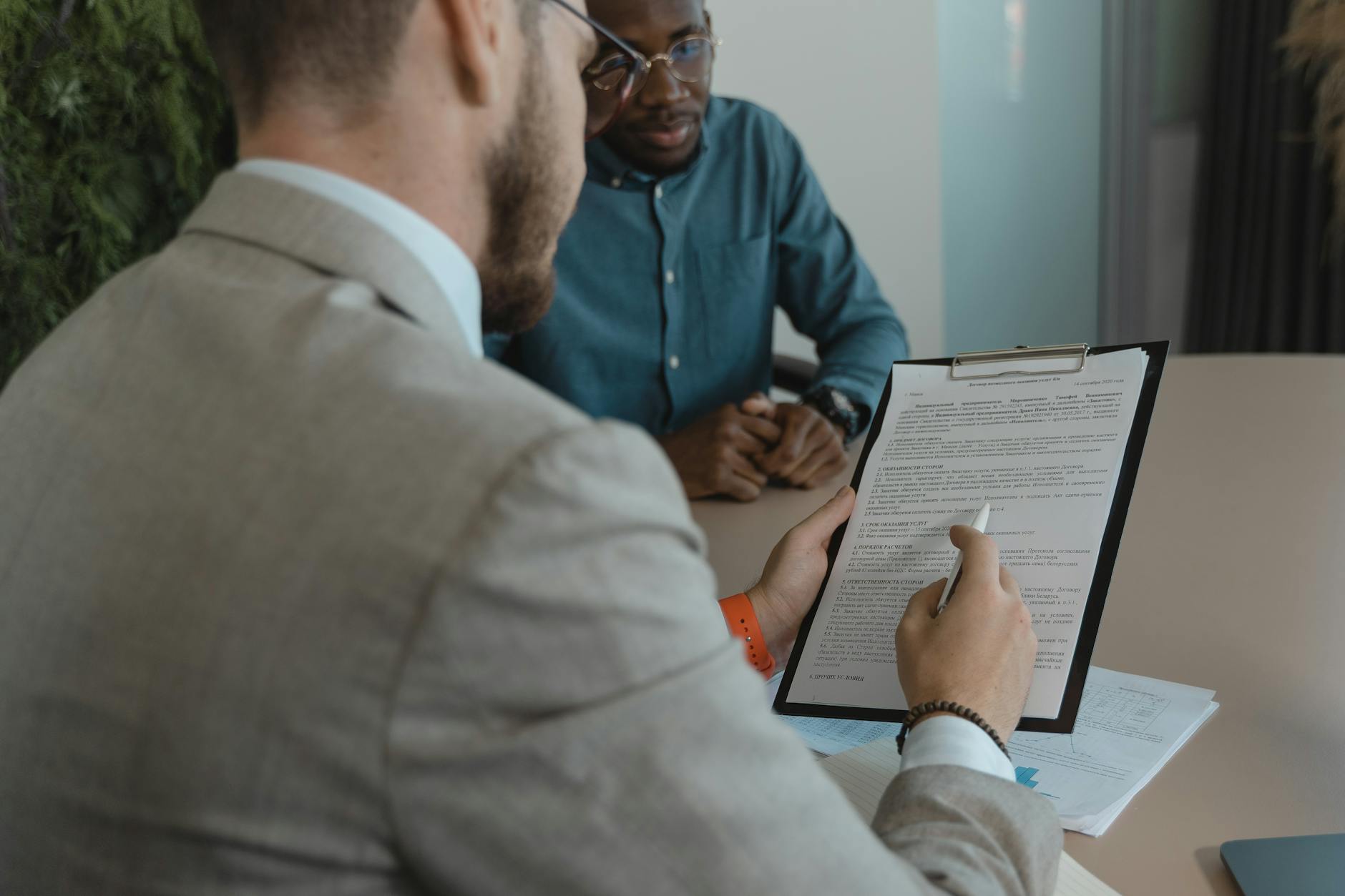 Recruiter reviewing interview notes and candidate documents